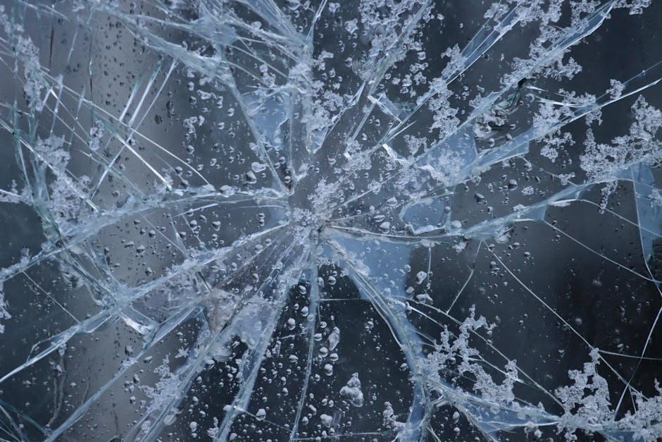 Cracked car windshield showing damage before replacement